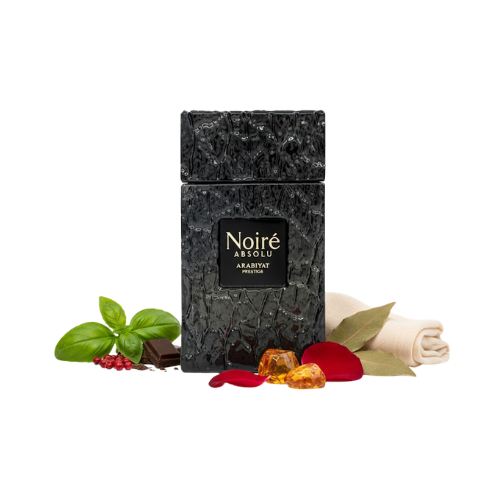 Detalle del frasco Noiré Absolu Arabiyat Prestige con textura negra profunda y placa central dorada de estilo premium